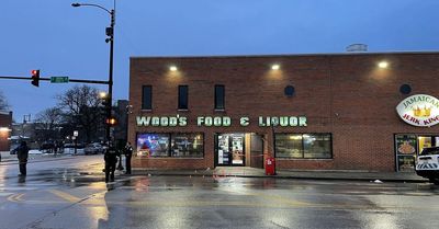 Woman killed during exchange of gunfire between security guard and gunman near police headquarters on South Side