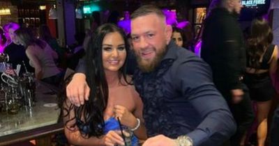 Conor McGregor poses for picture with one of the 'Dubai two' in Dublin pub