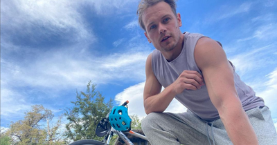 Sam Heughan jumps on his bike for new My Peak fitness challenge