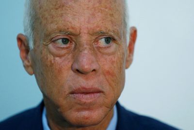 Tunisian president denies a coup but holds power tight