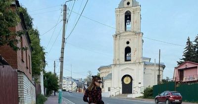 Model facing jail over 'offensive' photo after lifting up dress outside church
