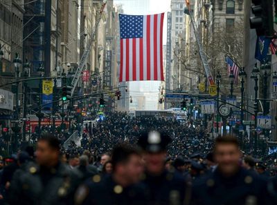New York police line streets to mourn slain officer