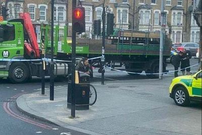 Cyclist rushed to hospital after collision with lorry on major north London road