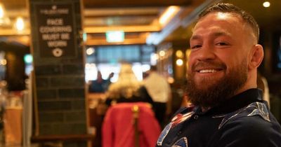 Conor McGregor flaunts huge stack of cash as he dines in his Dublin pub The Black Forge Inn