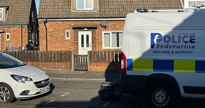 Boy, 2, dies and injured woman rushed to hospital after police surround home