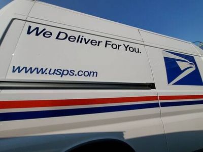The USPS was ready to go electric. Trump’s postmaster has other plans.