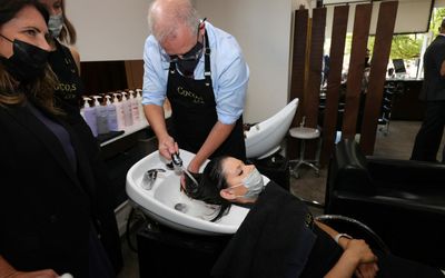 ‘Can hold a hose’: Morrison mocked for salon stunt