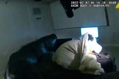 Police video shows man shot by officer was on couch, had gun