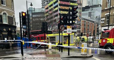 Woman in 30s dies after being hit by bus during rush hour at busy junction