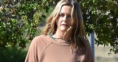 Clueless star Alicia Silverstone, 45, goes casual walking her dog on hike in Los Angeles