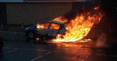 Dramatic photos show car ablaze at Scots retail park as emergency services rush to scene