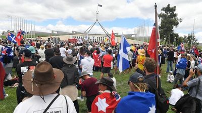 Thousands of protesters descend on Canberra's Parliament House to protest COVID-19 vaccine mandates