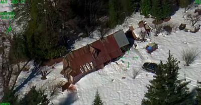 Couple rescued by helicopter after two months trapped in cabin by snow