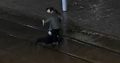CCTV footage shows victim punched, kicked and dragged onto tramline in Nottingham city centre robbery