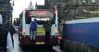 Edinburgh youths spotted dangerously hanging from back of Lothian bus