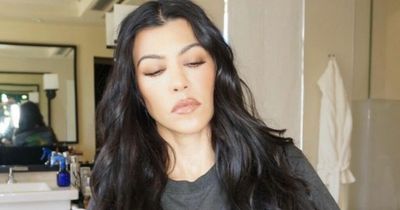 Kourtney Kardashian slams troll after she's accused of 'morphing into Travis Barker'