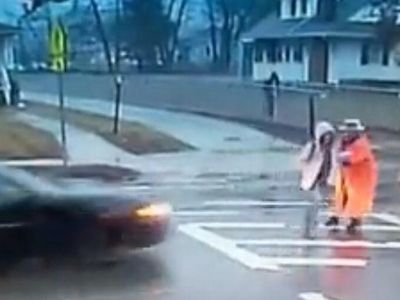 Shocking video shows crossing guard rescue child from path of speeding car