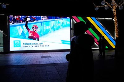 BEIJING SNAPSHOT: Cheering for China on cold, dark night
