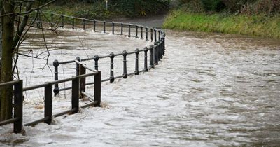 Dramatic images show River Mersey has burst its banks as flood warning issued and residents told 'act now and move to safety'