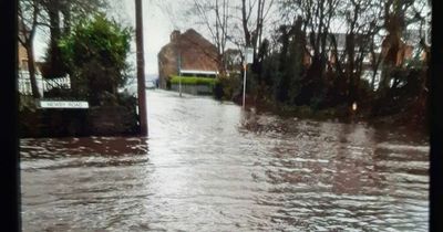 Streets flooded and river bursts its banks across Greater Manchester as residents issued warning