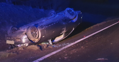 Photos show aftermath of horror crash as uninsured motor overturns on Scots road