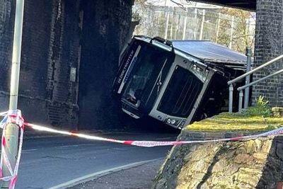 Lorry overturns striking railway bridge in Orpington