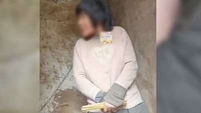 Video of Chinese mother chained by her neck sparks outrage