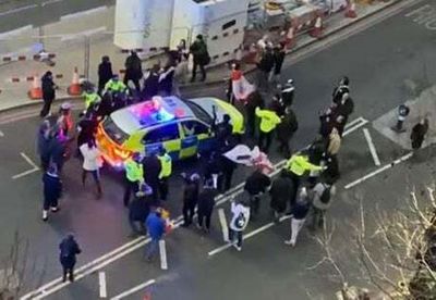 Sir Keir Starmer led into police car after protesters surround him shouting abuse and Savile slurs