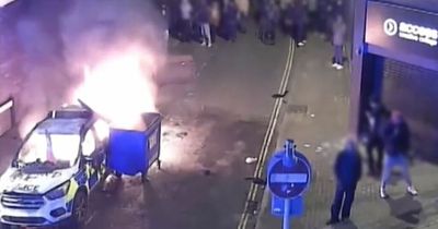 Bristol riot: Chilling video shows moment arsonist push wheelie bin into burning police car