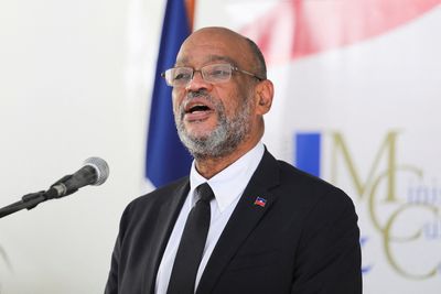 Haiti's Henry urges elections amid calls for transition government