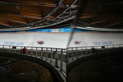 AP PHOTOS: A Day 2 filled with crashes at Beijing Olympics