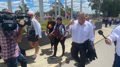 Activist who demanded Scott Morrison be sent 'to the gallows' escorted into Parliament House by Craig Kelly