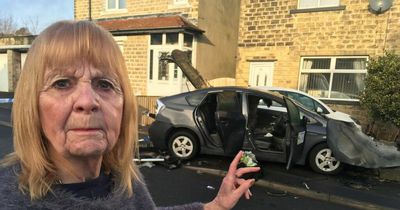 'I could have been in a lot of trouble' Pensioner helplessly watches as 'Uber' car smashes into her wall and bursts into flames