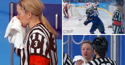 Ice hockey referee leaves rink covered in blood after being hit in face by stick at Winter Olympics