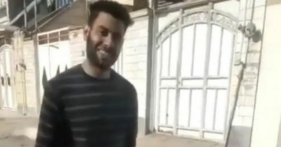 Man grins as he carries teenage wife's severed head through street after 'honour killing'