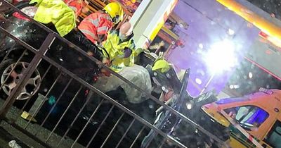 Person rushed to hospital after they were cut from car after smash at petrol station