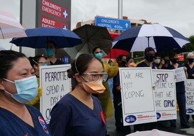 NSW nurses vote in favour of statewide strike, citing premier’s ‘tin-eared’ response to Omicron