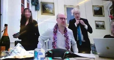 Boris Johnson under more pressure after new picture of party with open bottle of bubbly at No 10 Xmas quiz emerges