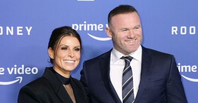 Coleen and Wayne Rooney all smiles as they pose at premiere of tell-all documentary