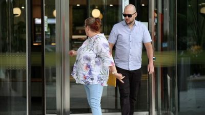 Canberra man who hit journalist for photographing him as he left court pleads guilty to assault