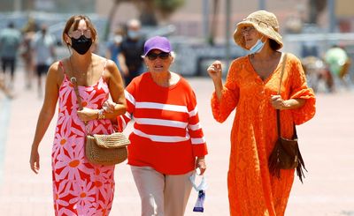 Spain scraps outdoor masks but many choose to keep them on