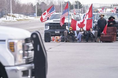 Trucker protests disrupt car plants in US, Canada