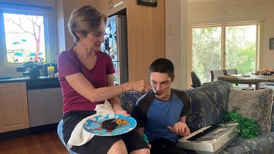 Families in crisis after NDIS funding cuts to participants with autism and intellectual disabilities