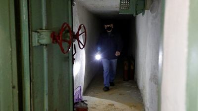 Ukraine braces for Russian invasion, residents scramble to find bomb shelters in bars, shops and strip clubs