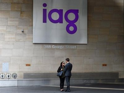 IAG turns H1 profit, cuts dividend