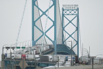 Canada trucker protest - live: Protesters remain on Ambassador bridge in standoff with police