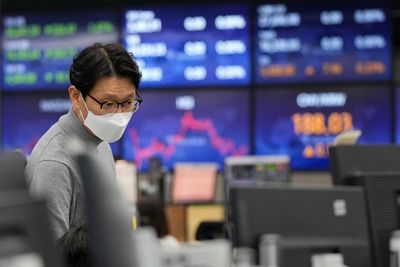 Asian shares skid as hot inflation data point to rate hikes