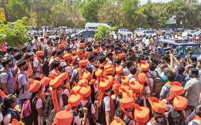 Karnataka High Court restrains students from wearing saffron shawls, scarves, hijab, religious flags in classrooms for now