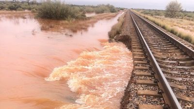 Flooding of Australia's major northern freight routes reignites calls for cross-country rail line