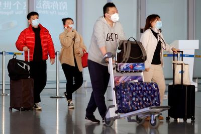 China says not granting passport renewals for non-essential travel